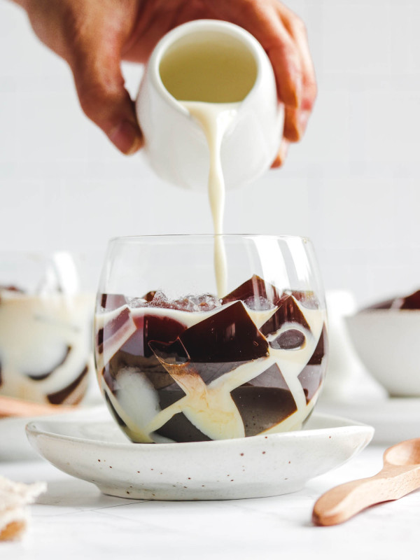 pouring milk into coffee jello dessert