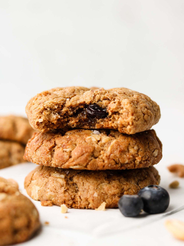 vegan oatmeal cookies stacked with a bite shot