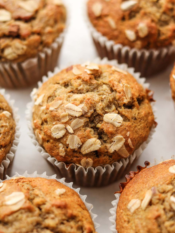 vegan banana oatmeal muffins with oats on top