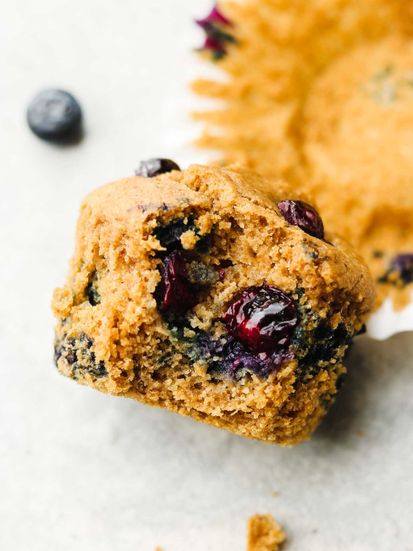 bite shot of almond flour blueberry vegan muffins