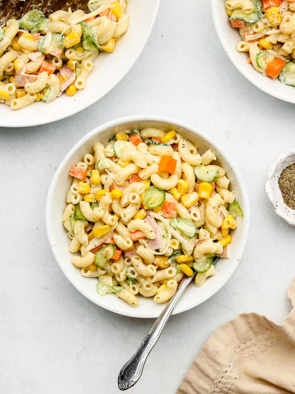 japanese macaroni pasta salad in a white bowl dressed in kewpie mayonnaise