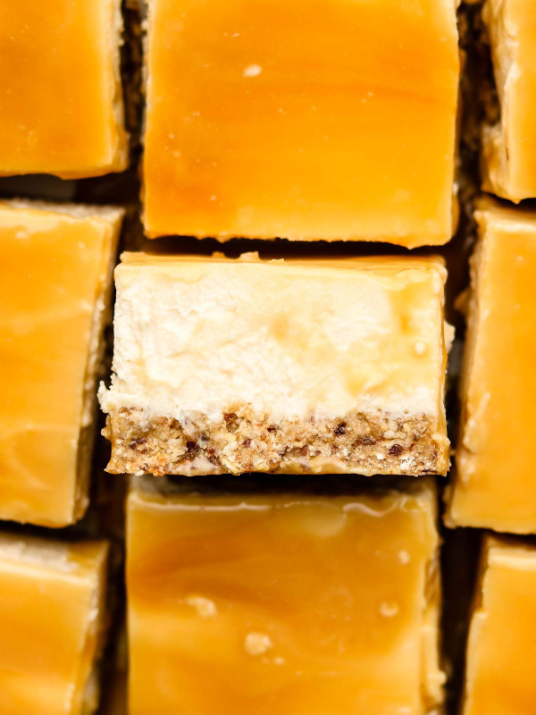 close up shot of no bake caramel cheesecake bars