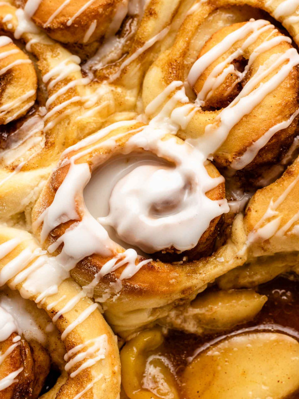 closeup shot of spiced apple cinnamon rolls with glaze on top