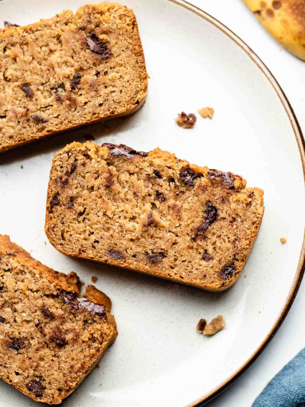 super moist cassava flour banana bread studded with chocolate chips on a ceramic plate