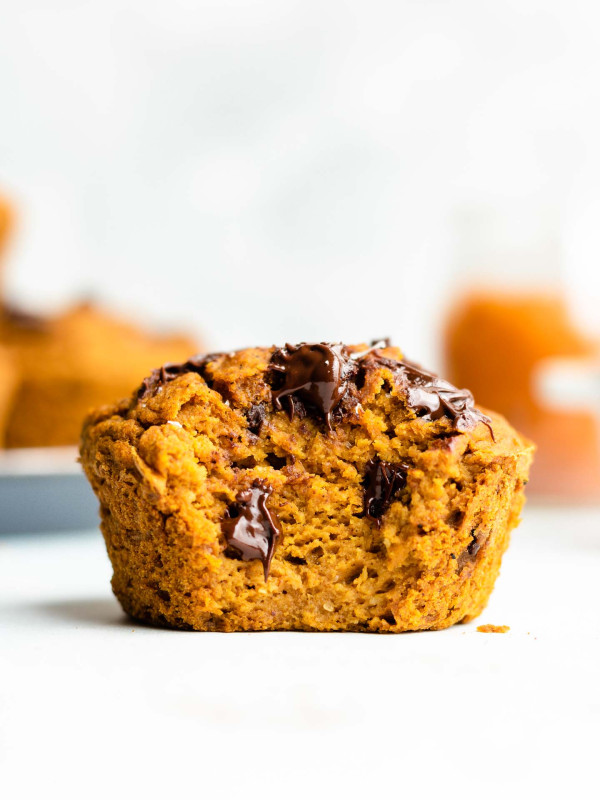 heathy flourless pumpkin muffins with chocolate chips, bite taken out of it