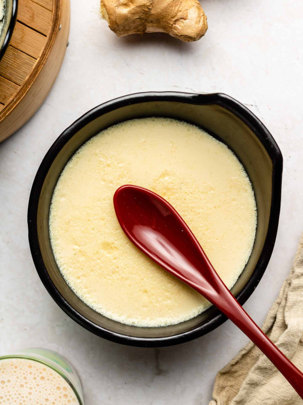 ginger milk pudding with a brown thin spoon on top
