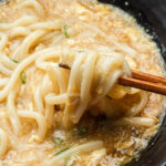 egg thick sauce udon noodles with chopsticks