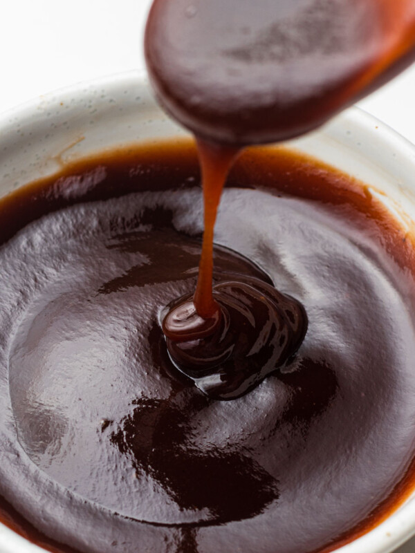 pouring homemade okonomiyaki sauce in a bowl