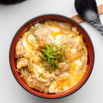 rice cooker oyakodon in a red bowl