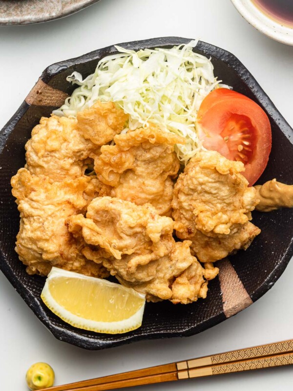 chicken tempura on a black plate