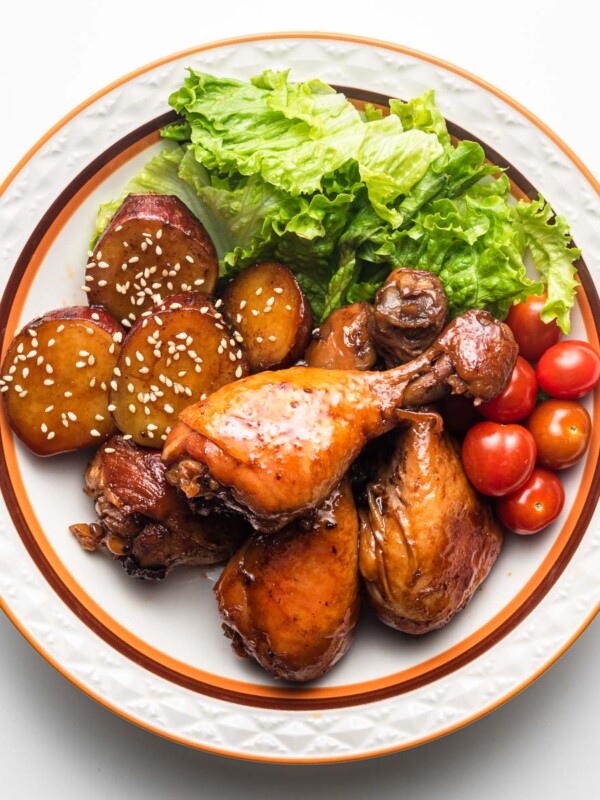 rice cooker teriyaki chicken in a bowl with tomatoes, lettuce and potatoes