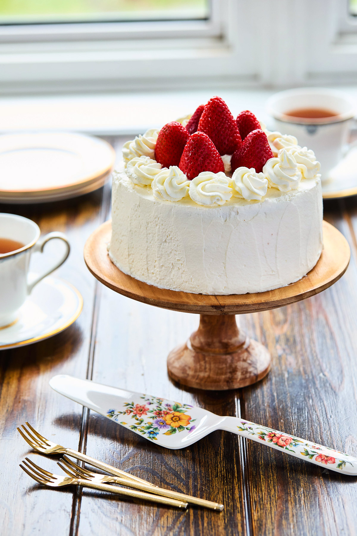 japanese strawberry shortcake on a wooden cake stand