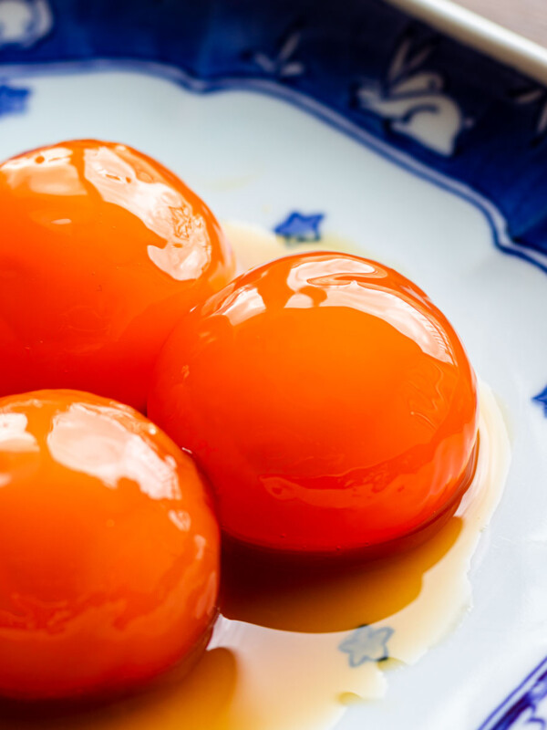 frozen egg yolks marinated in soy on a blue plate