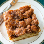 apple cake topped with a crunchy cinnamon sugar