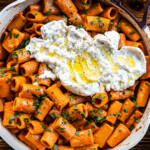 miso vodka pasta in a ourplace pan with burrata on top drizzled with olive oil