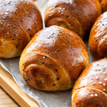 sweet potato cheese salt bread on parchment paper and serving tray