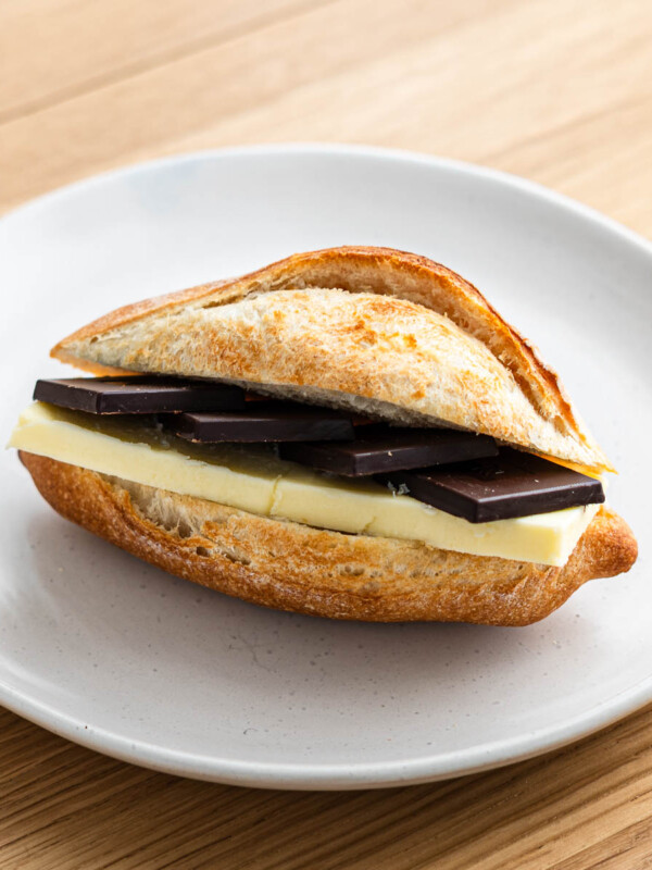 chocolate butter baguette sandwich on a white plate