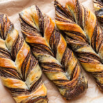 chocolate marble twist bread on parchment paper on a pink tray