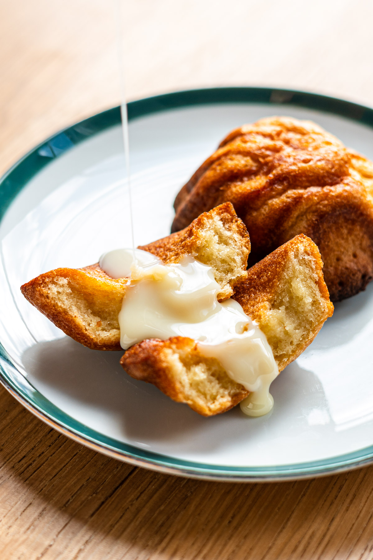 drizzling condensed milk onto crispy butter mochi
