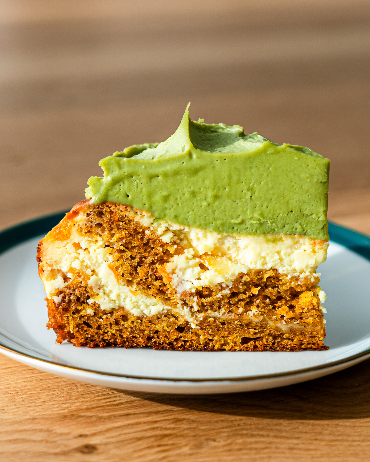 carrot cake cheesecake with matcha cream cheese frosting