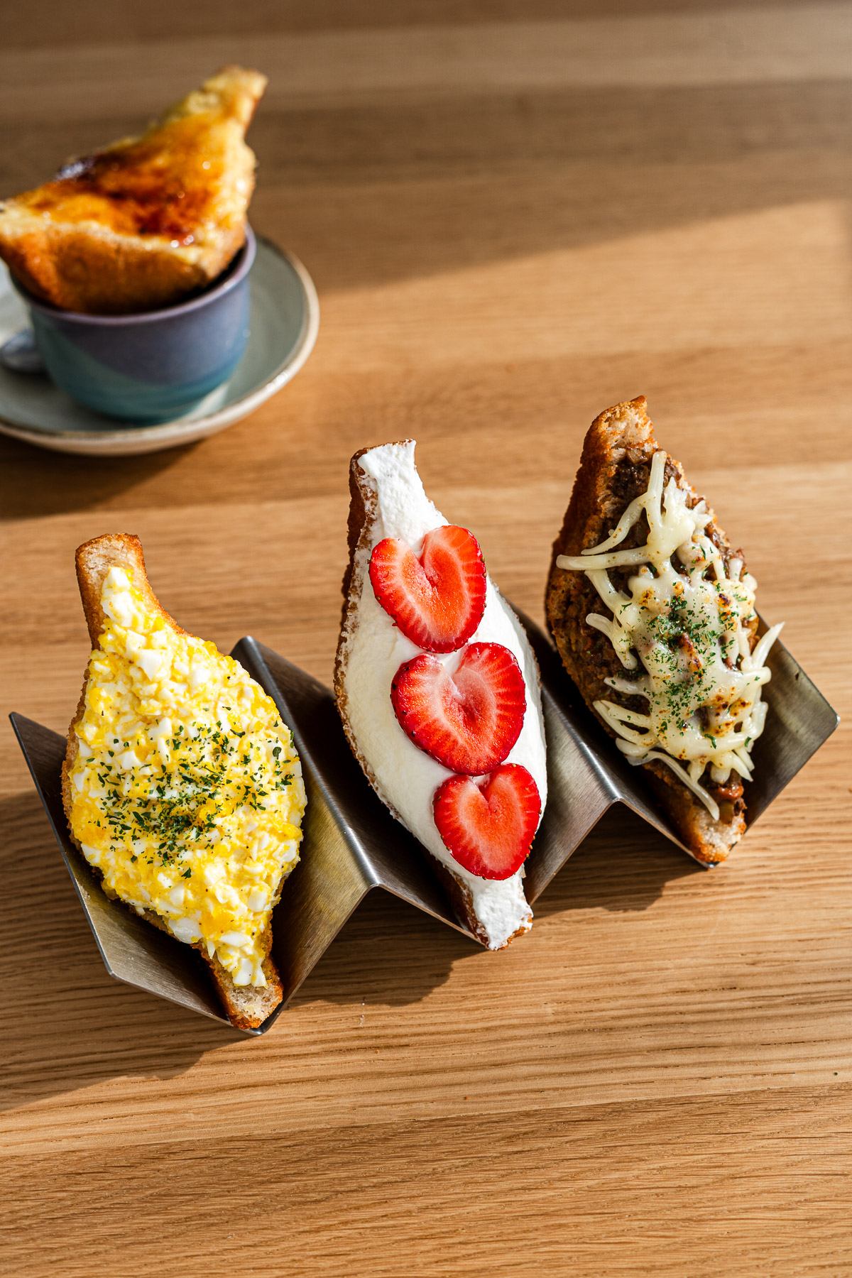 japanese fried egg salad and cream filled sandwich on taco holders