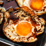sunny side up fried egg marinating in soy sauce